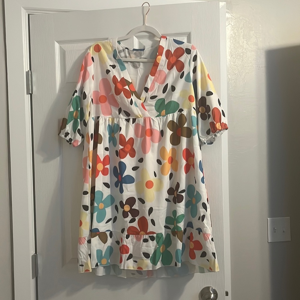 Brand new floral pattern dress runs big